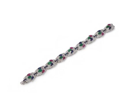 A GEM SET BRACELET Composed of pierced shaped links pavé set with brilliant cut diamonds, each centred with a carved ruby, em