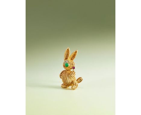 VAN CLEEF & ARPELS, A GEM SET NOVELTY BROOCH The standing rabbit composed of ropetwist strands, to cabochon emerald eye and e