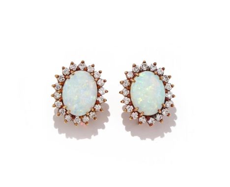 A PAIR OF OPAL AND DIAMOND CLUSTER EARRINGS Each oval cabochon opal within a brilliant cut diamond surround, post fittings, u