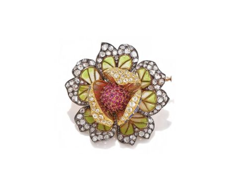AN ENAMEL, RUBY AND DIAMOND FLOWER BROOCH Modelled as a flower head, the plique á jour enamel petals edged with rose and old 