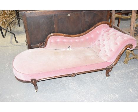 A Victorian mahogany framed chaise loungeOf small proportions, having a shaped button back scroll end within a mahogany frame