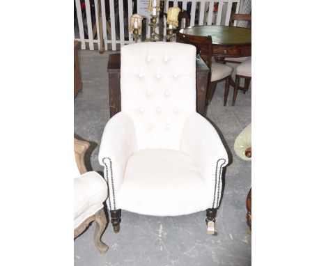 A Victoria button back drawing room chairHaving a rectangular button padded back above padded scroll arms and bow front seat,