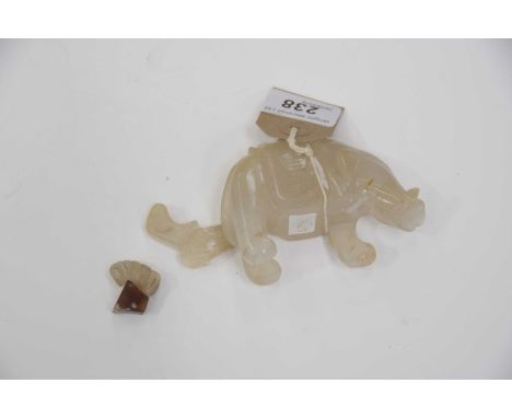 A Chinese pale white hard stone figure of a elephant Modelled in standing position with carved features and trunk raised (sev