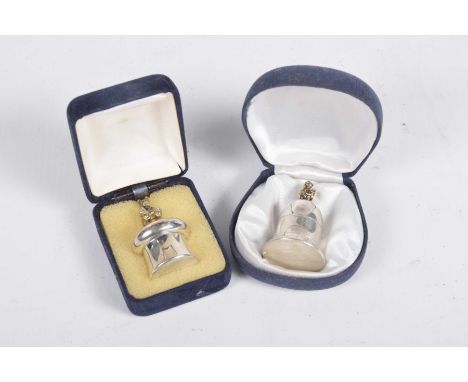 A silver trinket boxIn form of a bell with a silver gilt fairy finial, by H Bros, Birmingham 2001, together with, another sim