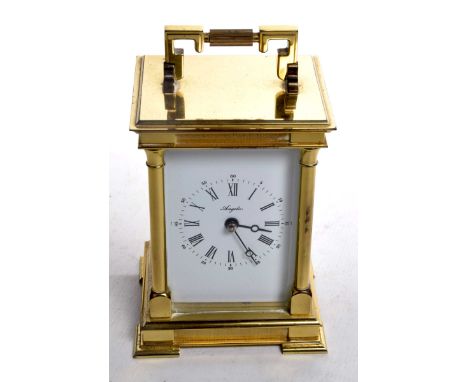 A brass Angelus carriage clock, late 20th CenturyWhite enamel dial with Roman and Arabic numerals, saucer bell, fold down han