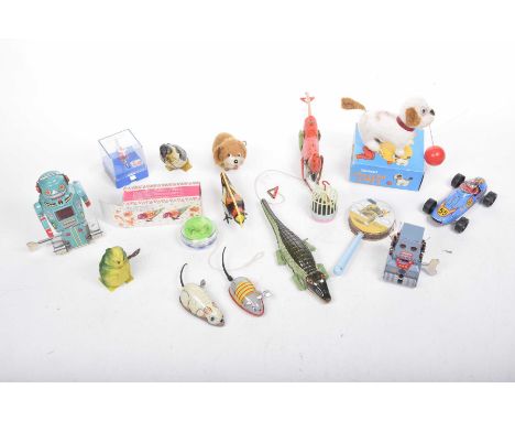 A collection of toysTo include a robot, racing car, Salco boxed clockwork cheerful puppy, Russian painted bird in original bo