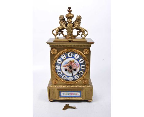 A late 19th Century gilt metal and Sevres style porcelain panel, 8-day mantel clockThe architectural gilt case detailed with 