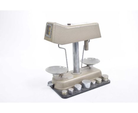 A set of Omal Universal Money Checker scales, late 20th CenturyComplete with weights.