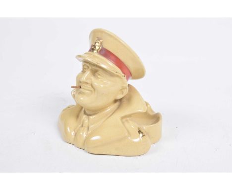 A Royal Doulton World War l period army club ash trayIn the form of a monocled Officer smoking a cigarette.