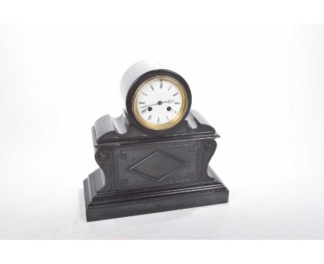 A late Victorian black slate eight day mantle clock Of architectural form, the 4inch white enamel dial with glaze front, the 