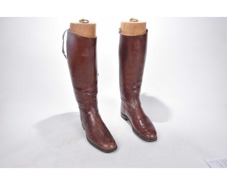 A pair of brown leather hunting bootsComplete with trees.    CONDITION REPORT:  Sole 31cmHeight 47cmCalf 15cmLeather worn but