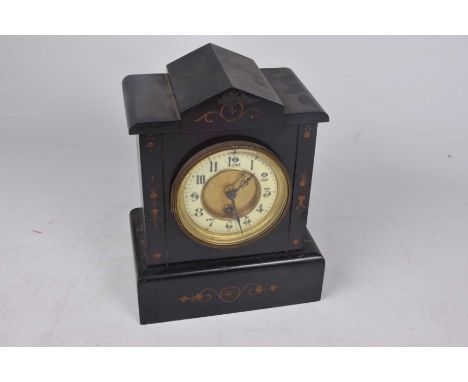 A slate mantle clock , early 20th CenturyWith cream enamel 11cm dial with Arabic numerals, height 27cm.