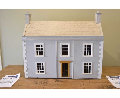 A vintage Georgian style dolls house The light grey painted house with Georgian windows, hinge doors enclosing  four internal