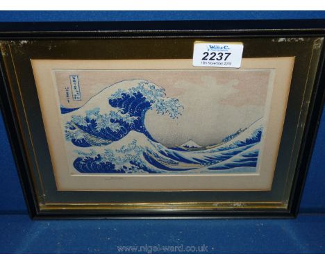 A small Print of 'Great wave of Kawanaga' by Hokusai.