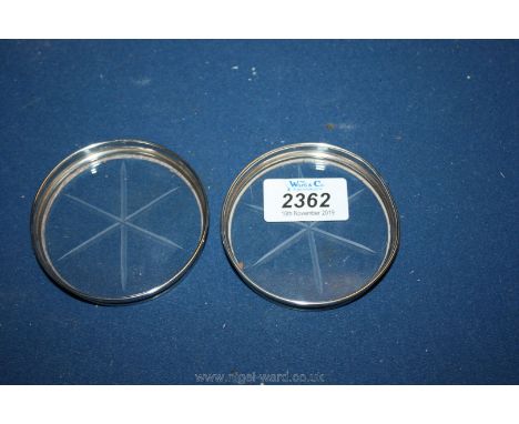 A pair of cut glass Coasters mounted in sterling silver, each 3" diameter.