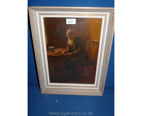 A Newlyn style Oil on canvas of old man seated at chair and table with light shining on him, framers Fred Ketch, Taunton/Exet