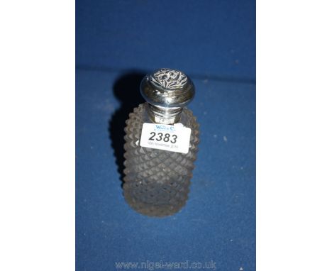 A silver topped perfume bottle with stopper, dated 1906, Birmingham, 5" tall.