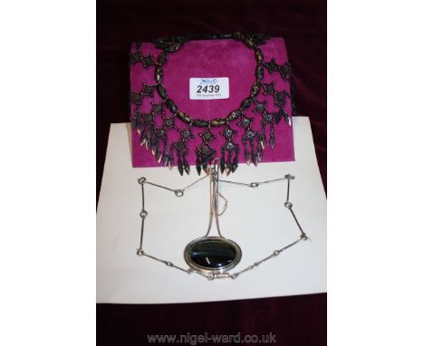 An unusual Edwardian collar Necklace in metal in filigree work and unusual contemporary silver necklace with dark stone, hall