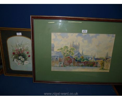 A framed and mounted watercolour depicting a Cathedral overlooking houses and gardens, signature faded to lower right. Along 