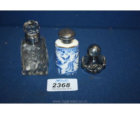 Three perfume Bottles, one with silver collar, one Spode with silver top and a small glass with silver top (mark indistinct)