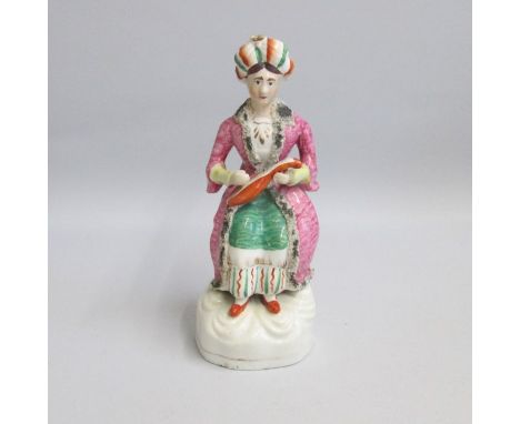 A Staffordshire figure of a lady musician playing a mandolin, dressed in Turkish attire.
Circa: 1850
Size: 21.5cm H
Condition