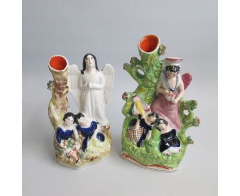 Two Rare Staffordshire Portrait Figures of Guardian Angels.&nbsp; One Angel guarding over two children lying asleep on a wood