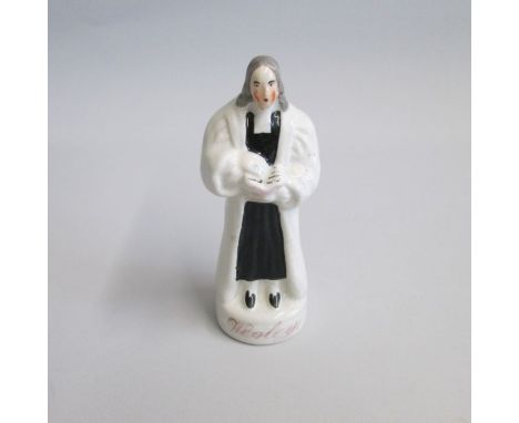 A Staffordshire Portrait figure titled Wesley in gilt script, this small figure shows John Wesley (1703-91), the founder of M