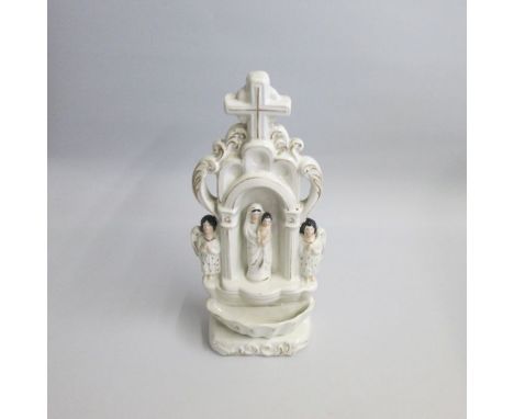 A Rare Staffordshire Portrait Figure of The Virgin Mary and child under an arch surmounted by a cross. An angel eitherside an