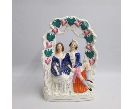 A Large Staffordshire of a courting couple reclining under a bower arch of flowers
Date: Circa 1860
Size: 35cm H
Condition: S