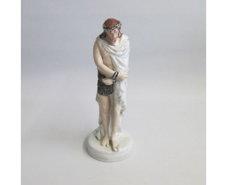 A Rare Staffordshire Portrait Figure of Jesus with a crown of thorns and bound wrists, standing on a round base, with a long 