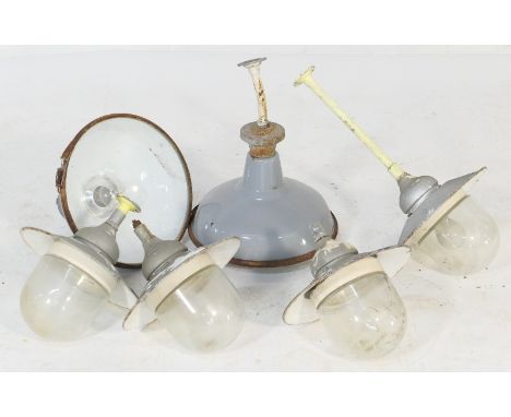 Six industrial lighting units, including two grey stove enamelled cowls with slightly domed clear glass covers intact, the re