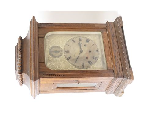 German oak cased chiming bracket clock, retailed by Schierwater & Lloyd, Liverpool, gadrooned caddy top over a floral chased 