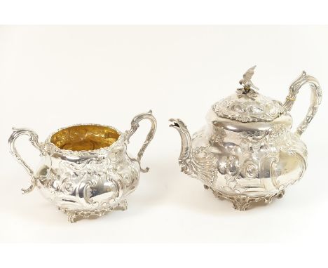 Victorian silver teapot and matching sugar basin, Sheffield 1856, the teapot of baluster form chased with flowers and C-scrol