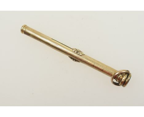 Gold propelling pencil/pen, engine turned decoration and inset with a bloodstone terminal, unmarked but testing as 9ct gold, 
