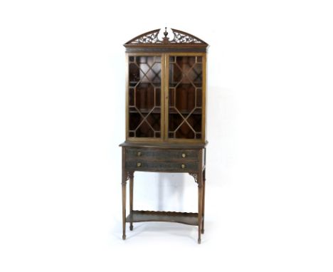 Late Victorian mahogany display cabinet on stand in the Chippendale style, the top with fretwork pediment centred with a turn