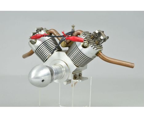 A HANDBUILT V2 4 STROKE MODEL AEROPLANE ENGINE, built by Gordon Williams of Aldridge, 30cc petrol engine, said to be in worki
