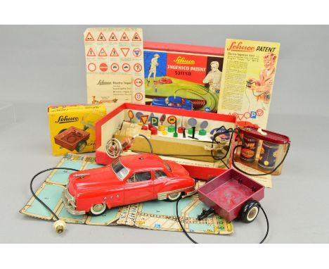A BOXED SCHUCO ELEKTRO-INGENICO CAR, No.5311, red car, complete with all signs and accessories, tools, hand control, instruct