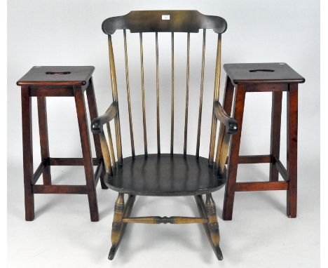 Two wood bar stools with cut out hand hole to seat, 74cm high, together with a stick back rocking chair, embossed mark to bas