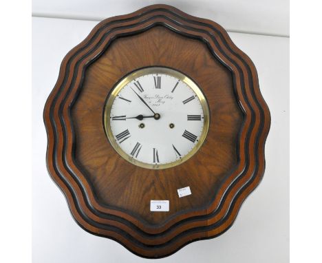 A 20th Century boudoir wall clock, the cream enamel dial with Roman numerals, within a shaped wooden frame with painted detai