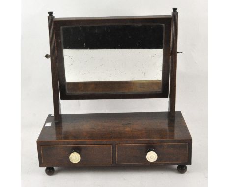 A Victorian mahogany dressing table mirror, the rectangular mirror raised over two drawers, each with bone handles, 44cm x 42