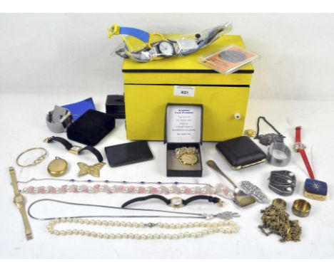 A yellow and black painted box with slanted mirror containing various wristwatches, enamel boxes, costume jewellery, and more