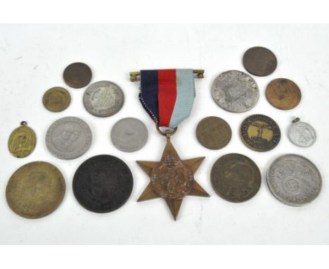 A selection of coinage, including a Third Reich coin and a 1939-1945 Star medal, all in a vintage leather and gilt round box