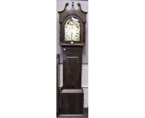 An early 19th century mahogany veneered longcase clock with broken swan neck pediment set with a brass eagle on an orb over a