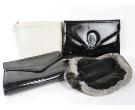 A selection of vintage items, including two patent leather handbags, a fur hat, a white leather letter writing set, and a Str