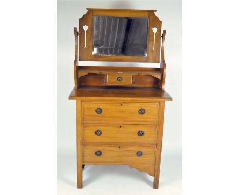 A late 19th/early 20th century satin walnut dressing table, the swing mirror with pierced flower motifs above one small drawe