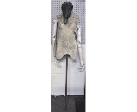 A surreal mannequin with a composition and wood human upper torso and a goat's skull head, 160cm high