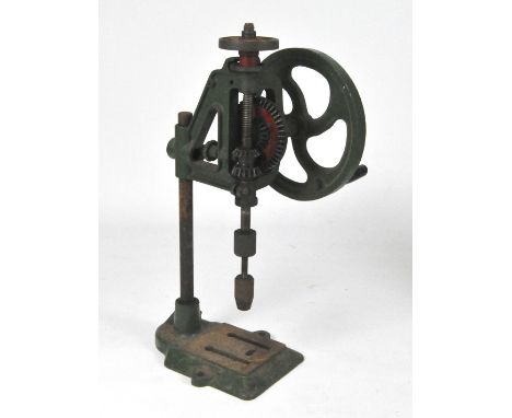 A Bradson manual drill block in green painted cast metal, 69cm high