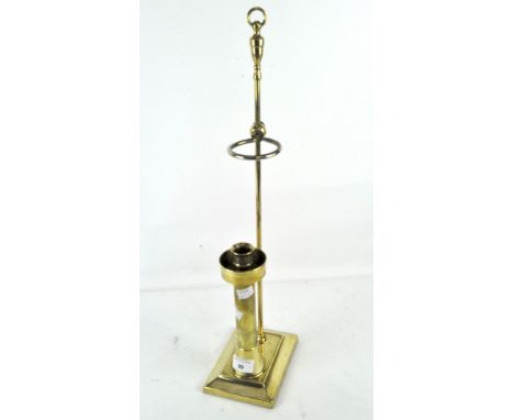 An unusual adjustable brass candlestick, 56cm high