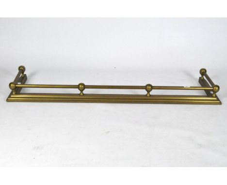 A yellow metal fire fender with continuous railing supported by spheres, width 137cm