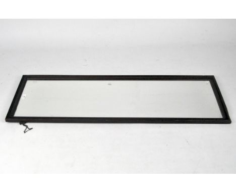 A dark stained oak full length rectangular bevelled dressing mirror, 128cm x 44cm